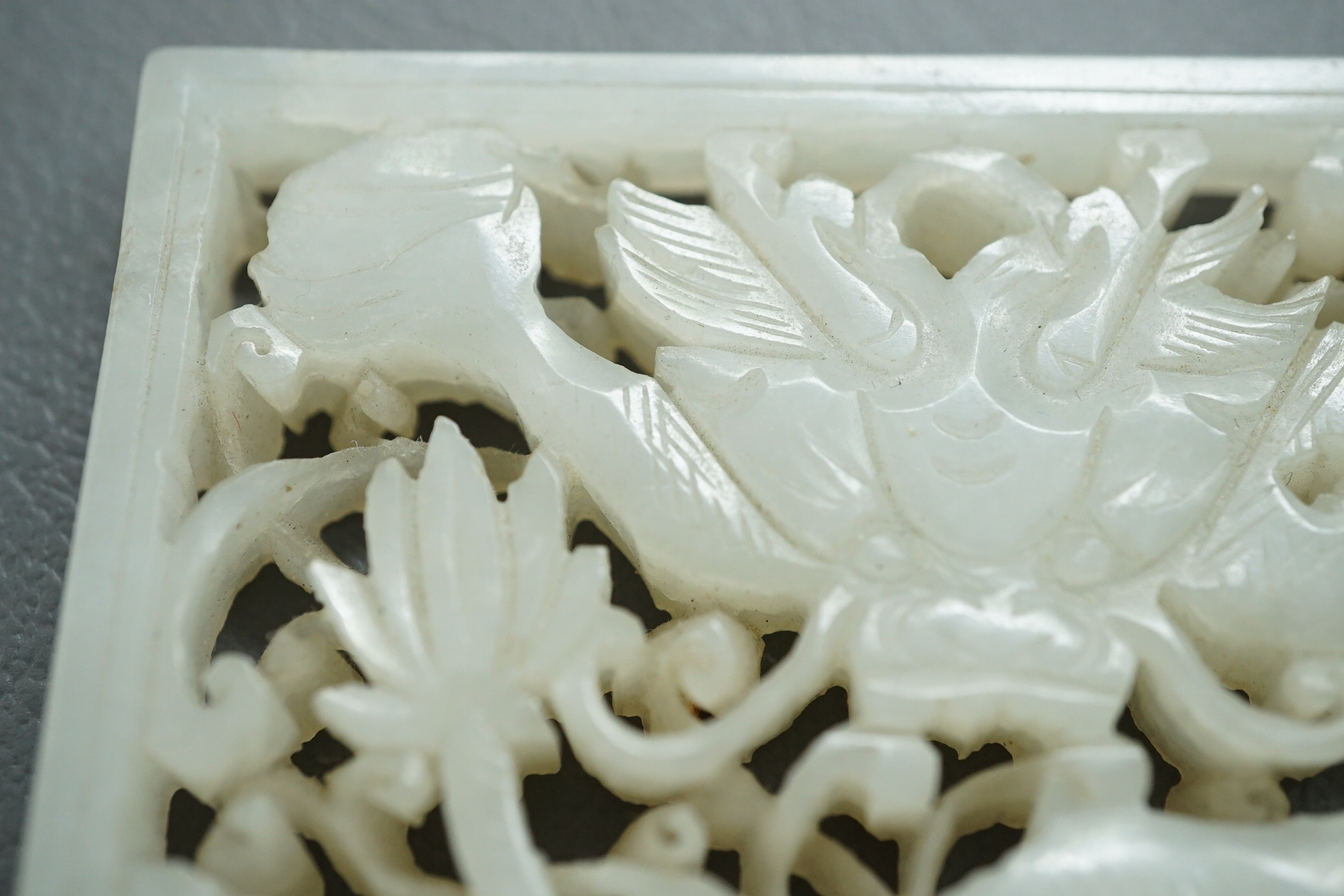 A Chinese white and black jade figure of a recumbent tiger, Song dynasty